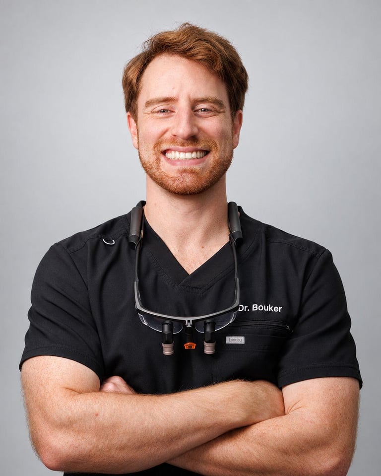 Logan Bouker, General Dentist in Humble Dr. Logan Bouker, General Dentist, in black scrubs at Aroma Dental in Humble, TX.